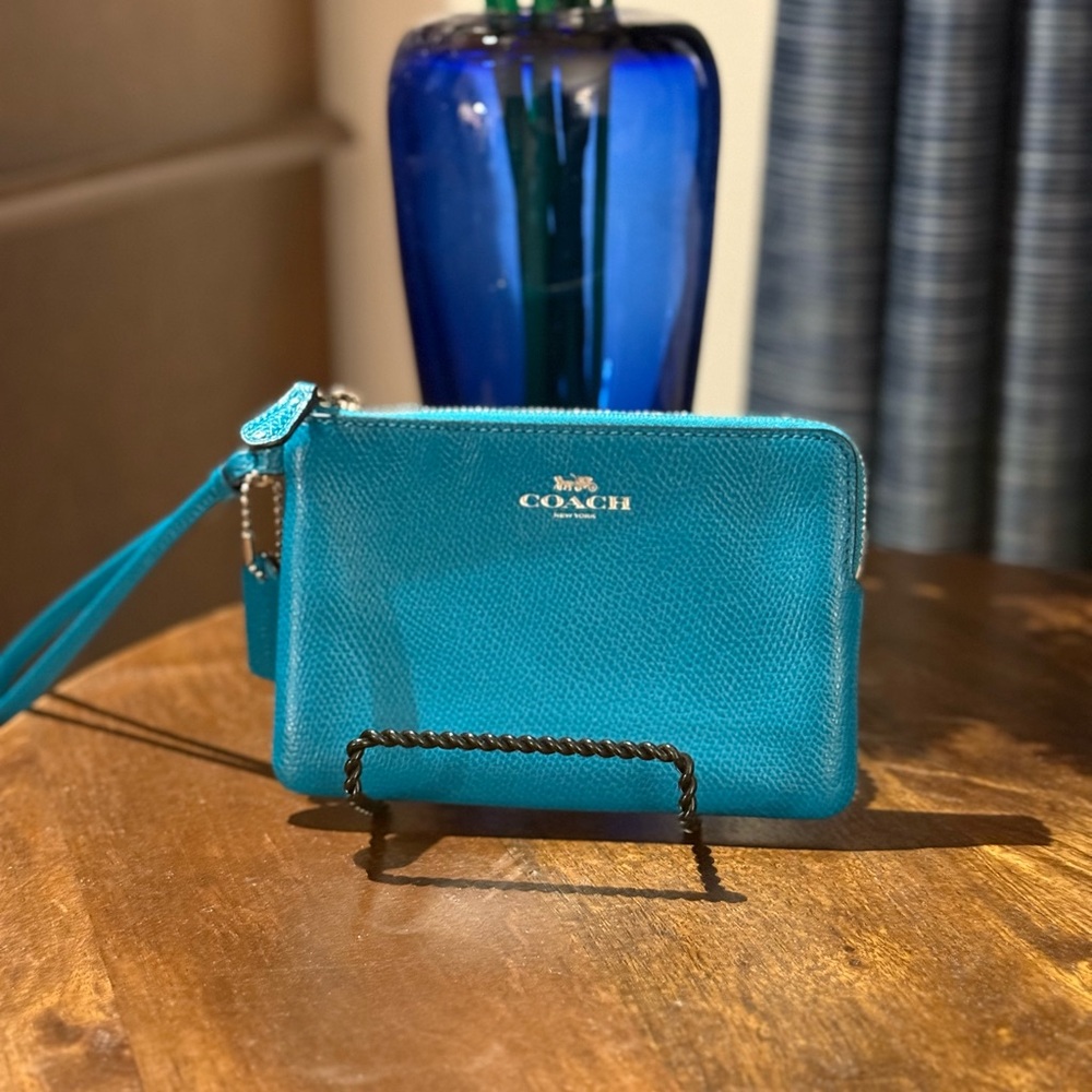 Coach turquoise Wristlet. Beautiful condition.